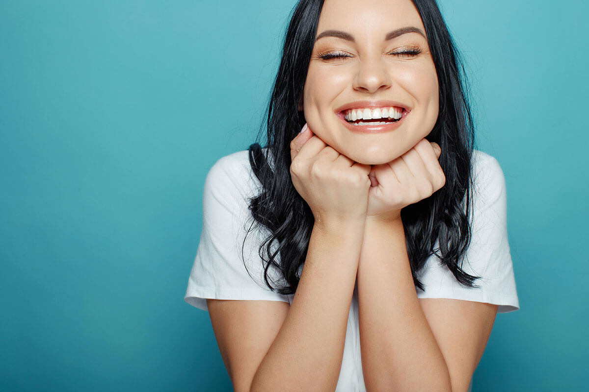 woman smiling after cosmetic dentistry