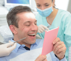 male patient smiling after dental bonding