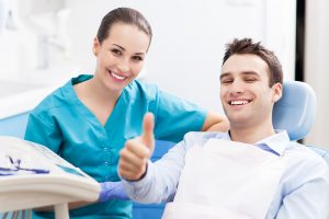 Patient smiling with a dentist near you