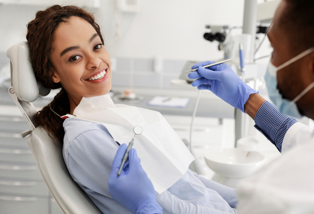 smiling patient in dental chair