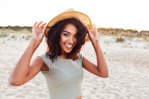woman smiling after getting dental implants