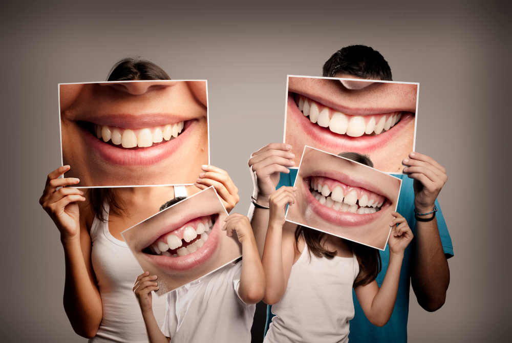 A family is happy with the results of their fluoride treatments.